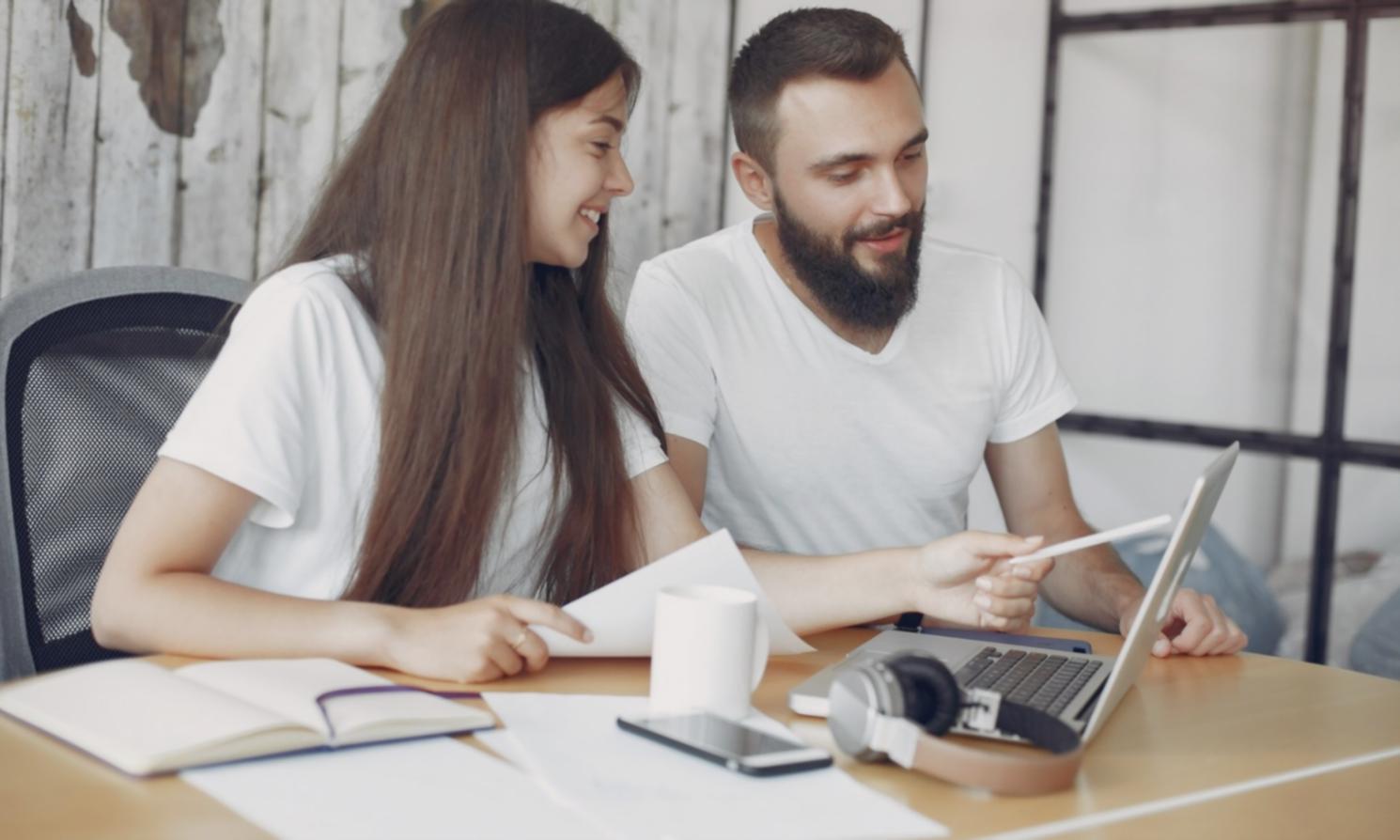 Business professional reviewing financial reports and budget analysis on computer screen